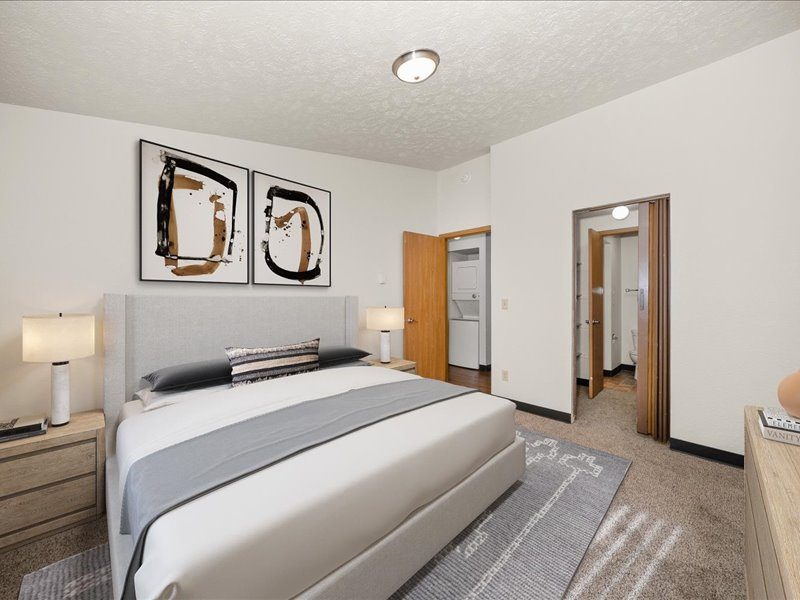 Staged Primary Bedroom looking into hall and closet, unit style 2B